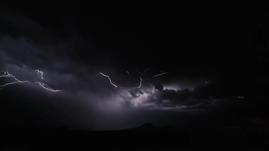 Lightning flashing in the sky at night