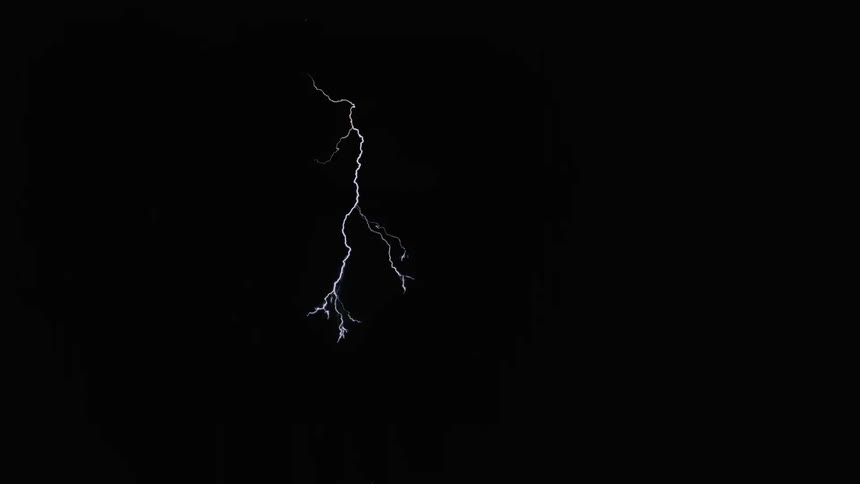 Lightning flashes in the dark night sky