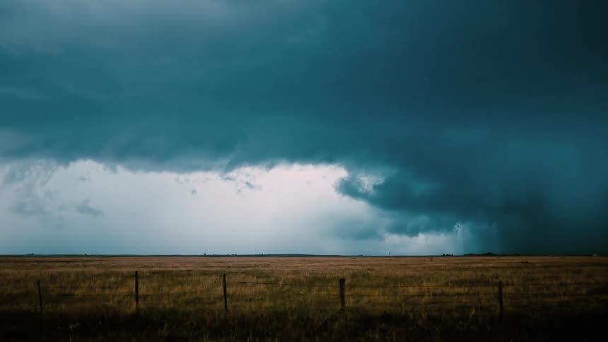 Lightning strikes a field during a storm