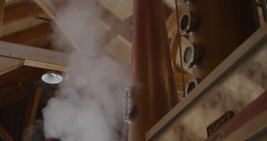 A man is working in a distillery