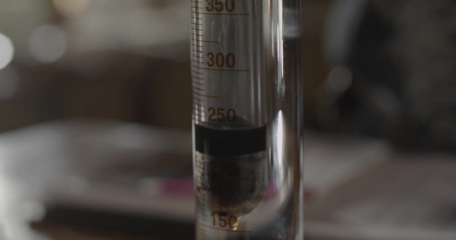 Close up view of numbers on a beaker with liquid in it