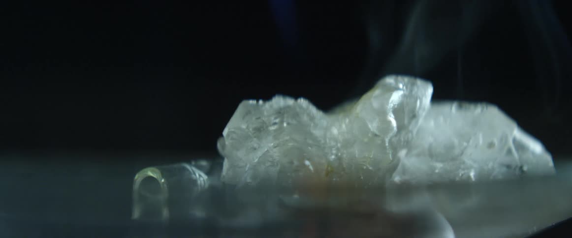 Some white object being melted by fire