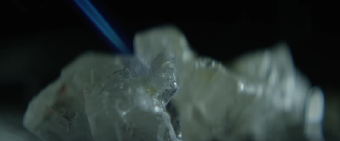A white item being melted by a torch