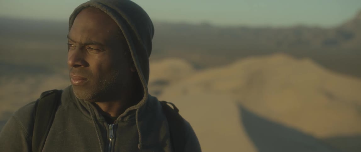 Man is moving and looks over his shoulder