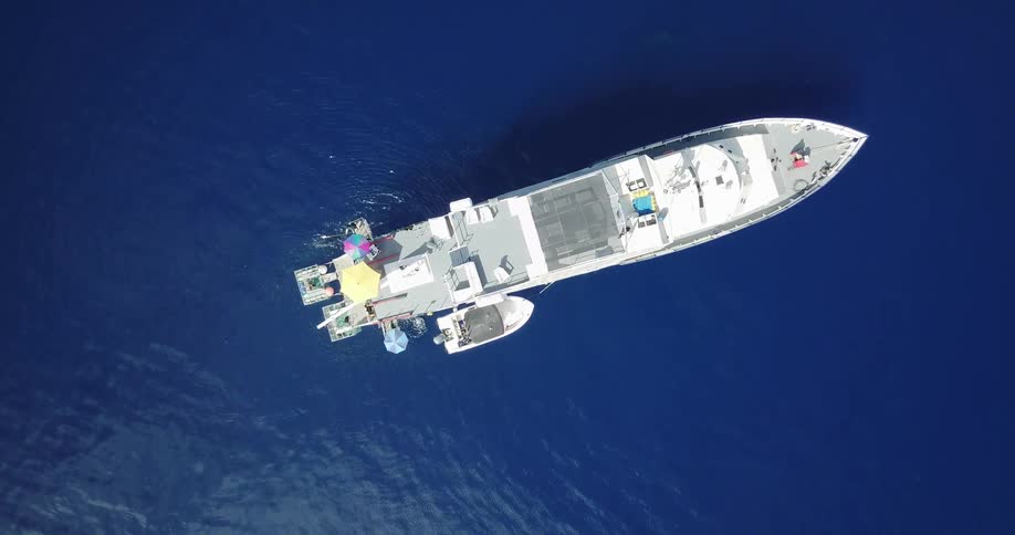 Aerial view of a large boat floating on water