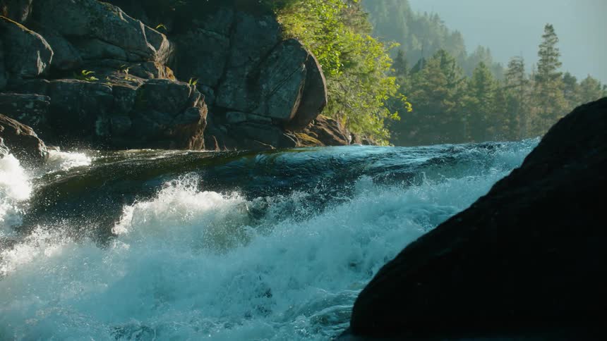 A river gushes and splashes in the wilderness