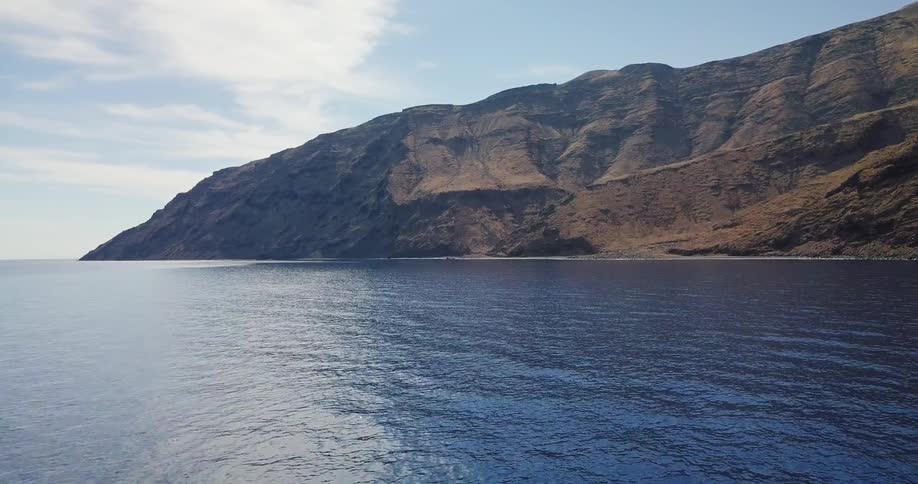 A body of water near a mountain