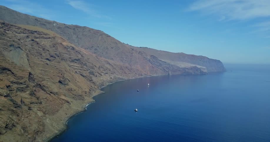 Hilly shoreline and a large body of water