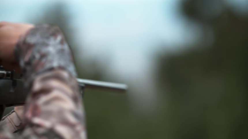 Person shoots gun outside and a bullet flies