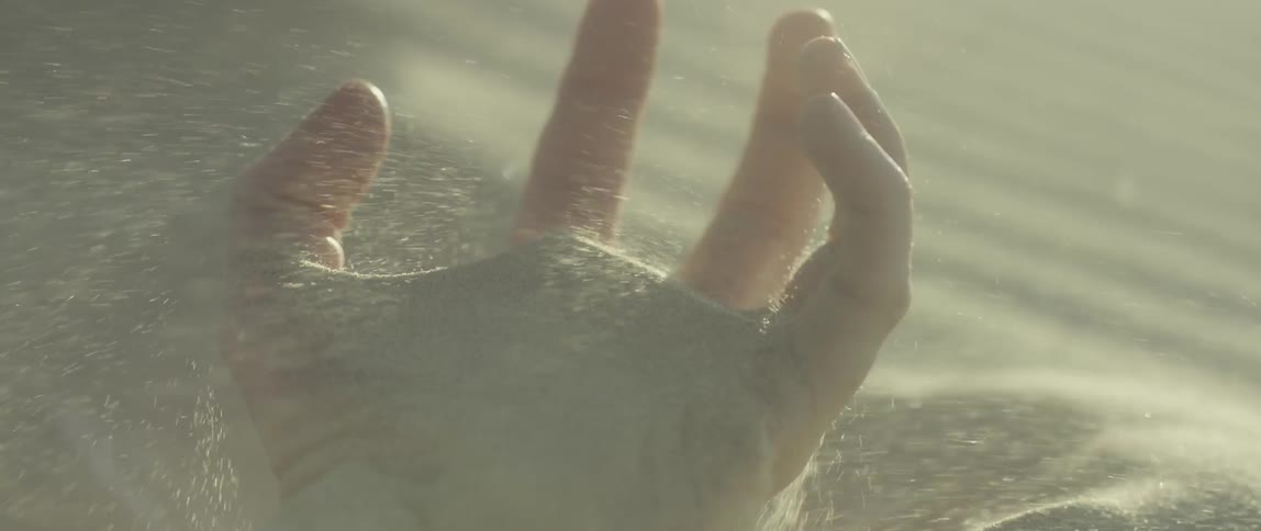 Sand running thru fingers