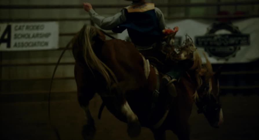 Man riding a bucking horse
