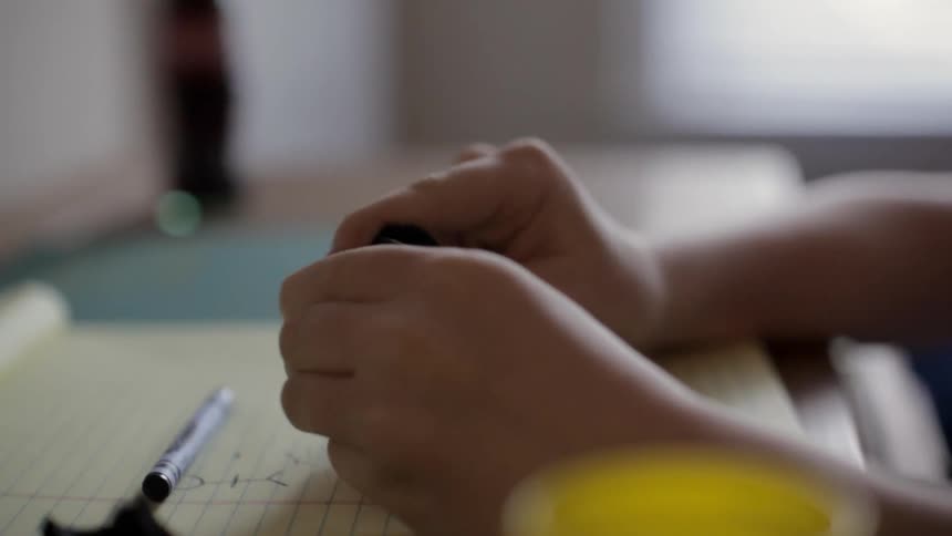 Person molding something on a pad