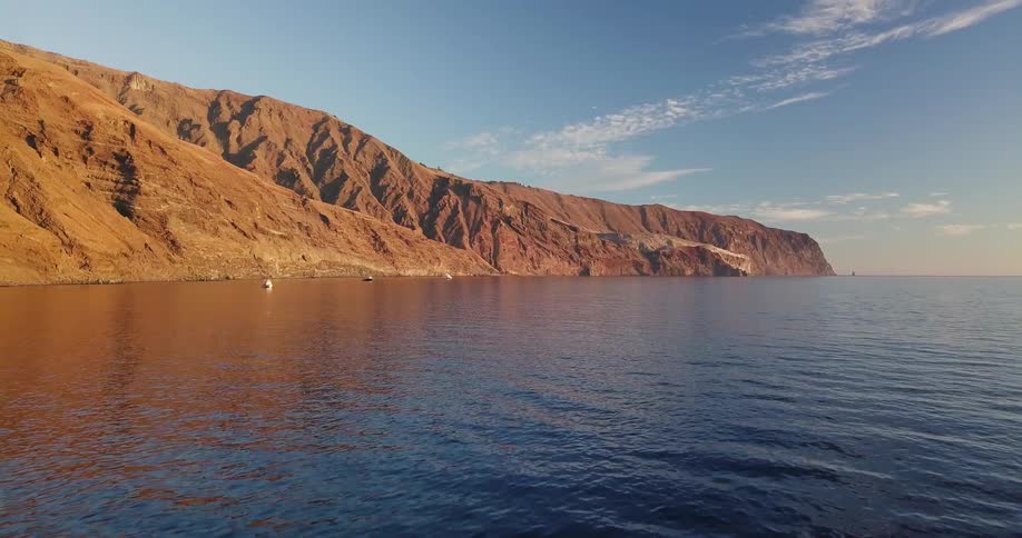 View of flowing body of water and sandy hills