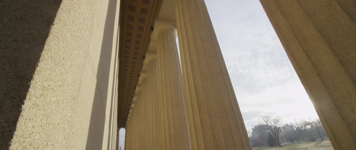 View of some large pillars near a wall