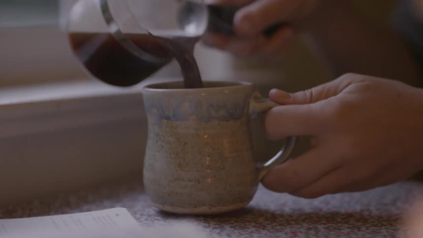 Coffee being poured into a mug