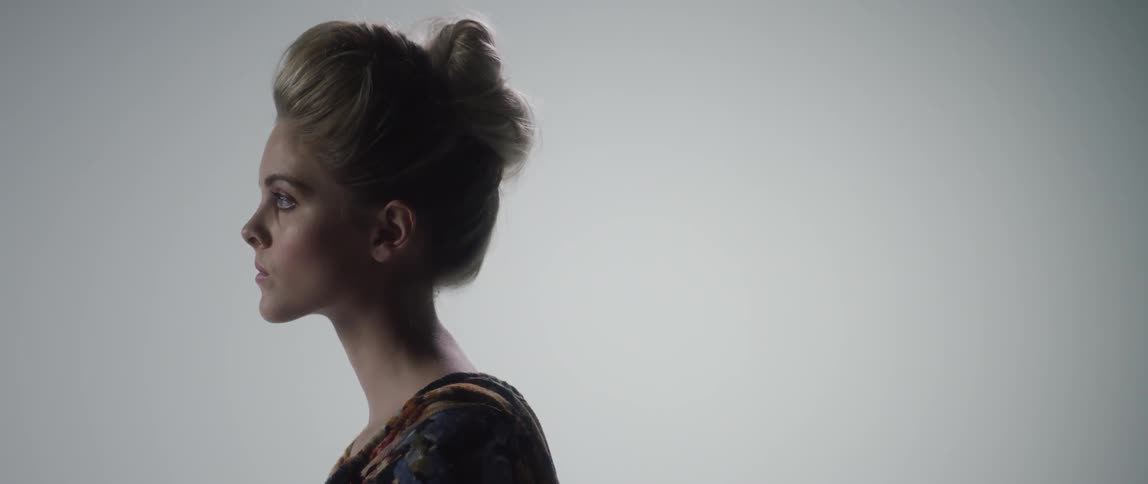 A woman with her hair in a bun