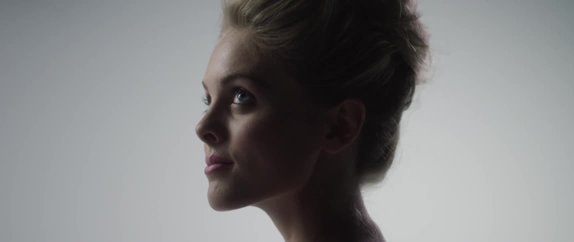 Woman looks up as she smiles