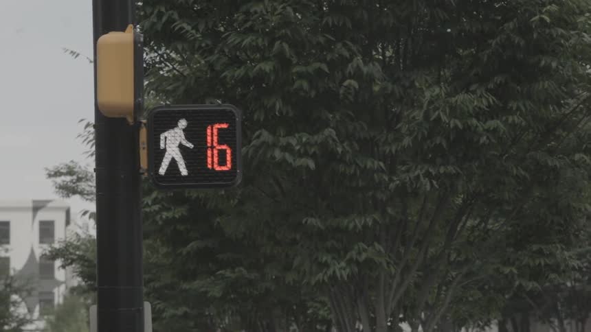 A crosswalk counting down