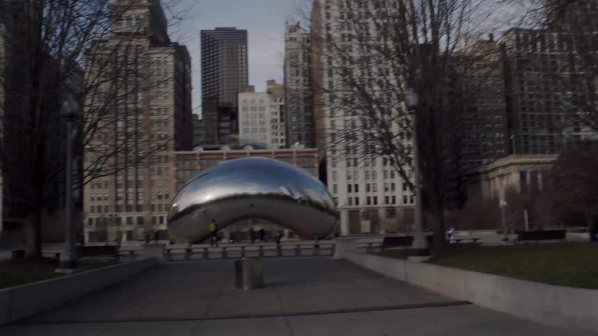 A silver sculpture in a park square