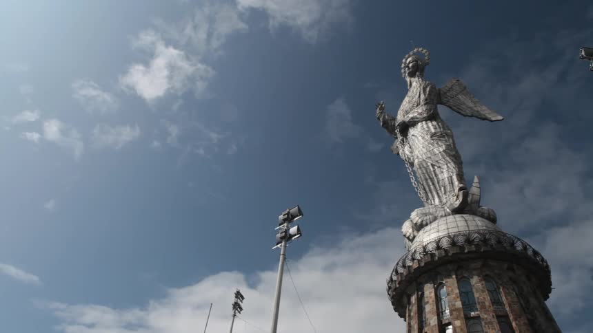 A tall statue on top of a building