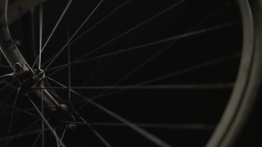 A close up shot of a bicycle wheel spinning
