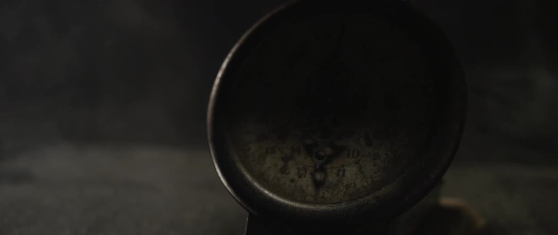 A dirty instrument is shown in a dark area