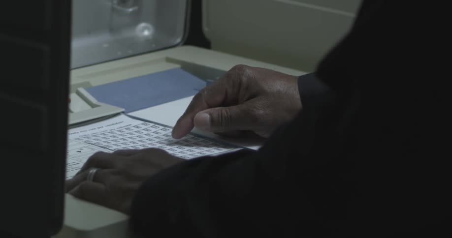 Close up of hands pointing to a book