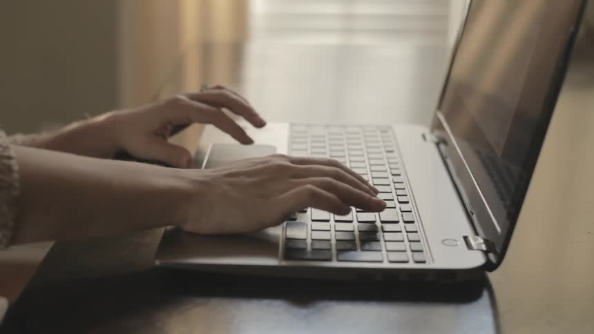 Person typing on a laptop