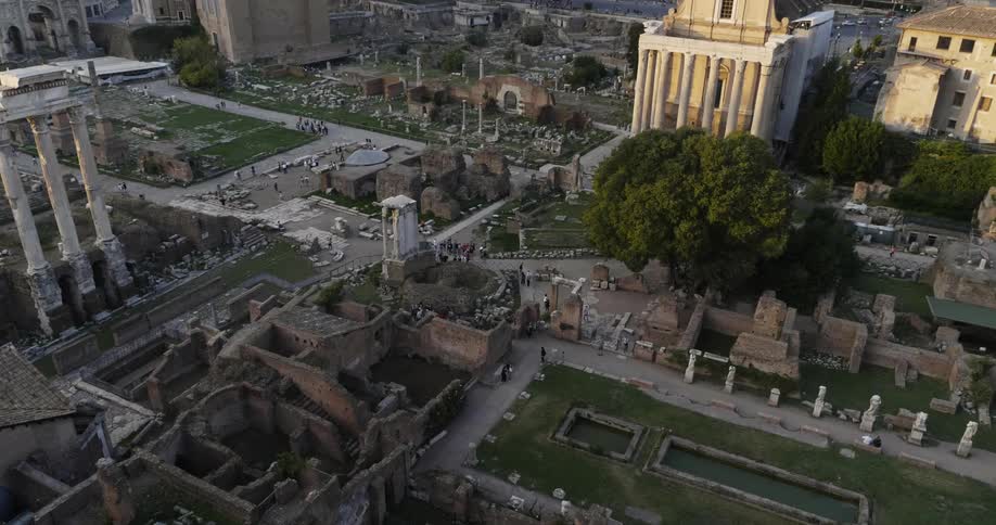 Tourists wander through a sprawling complex of ancient ruins