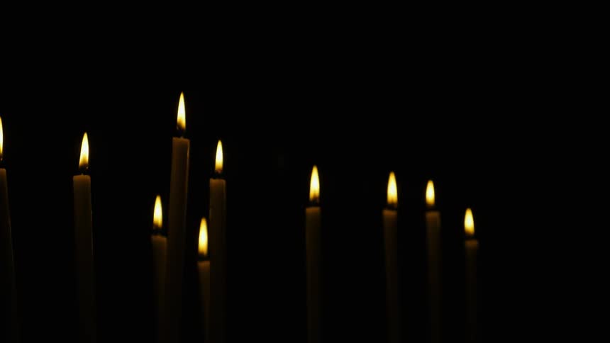 Candles burning in the dark