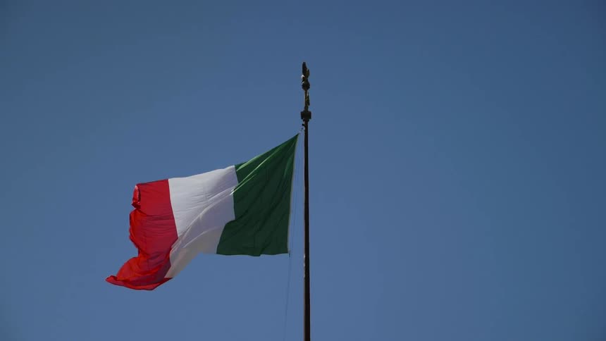 Flag waving in the wind on a clear day