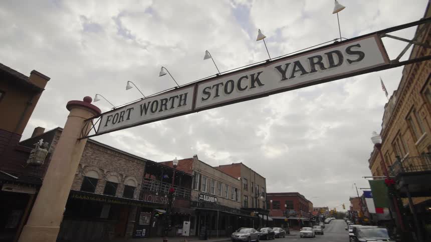 A city street is shown on a cloudy day