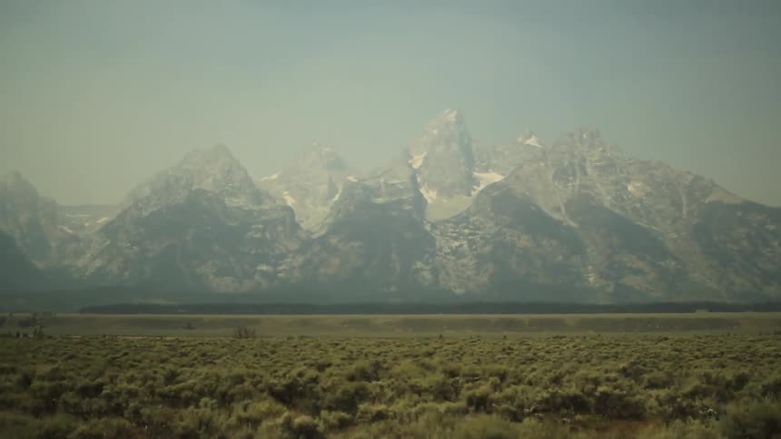 Driving past fields and mountains