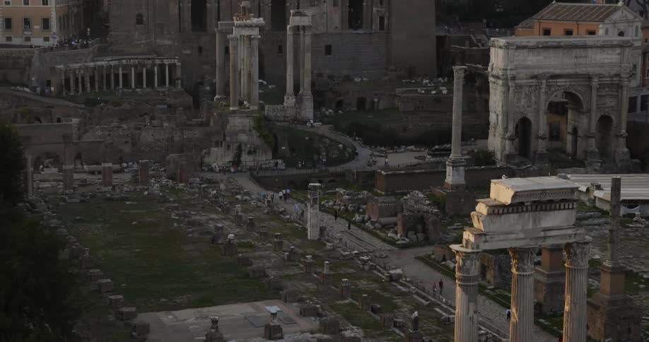 Tourists wander through a sprawling complex of ruins