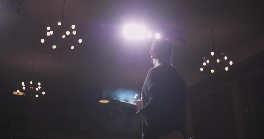 A man is giving a presentation on stage