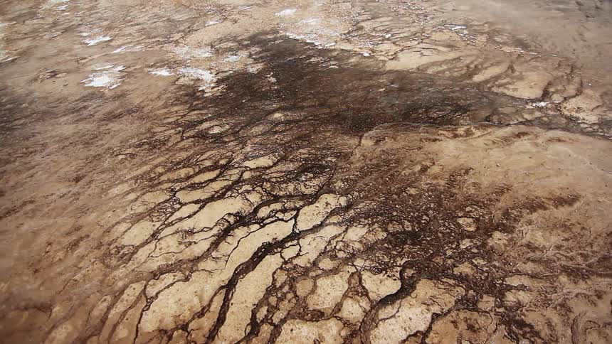 Overhead view of cracked and dry ground