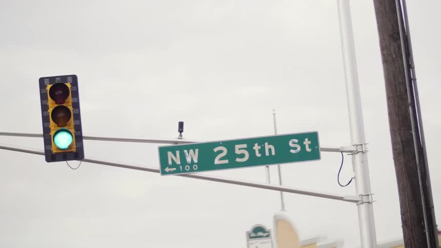 Close up of a street light and sign
