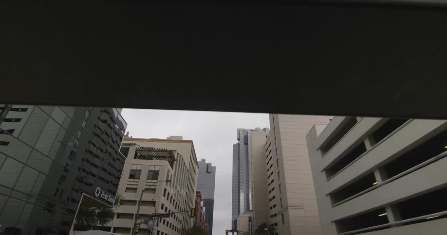 A car drives on a city street