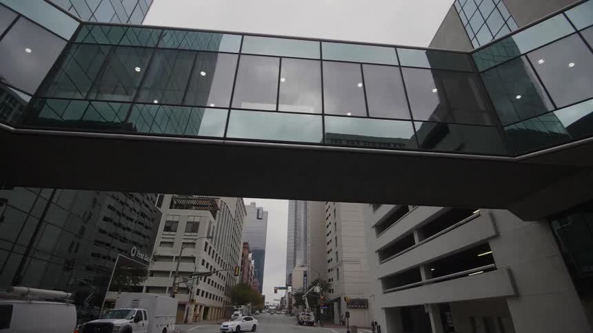 A glass bridge over a street