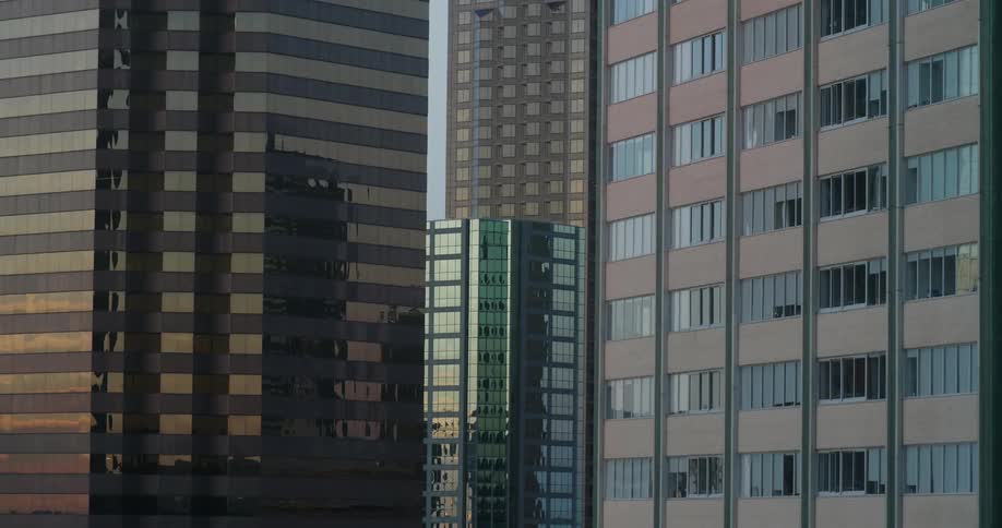City skyscrapers reflect the sky at sunset