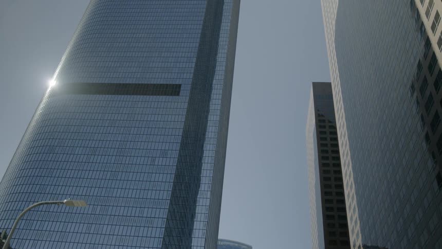 View looking up at skyscrapers on a sunny day