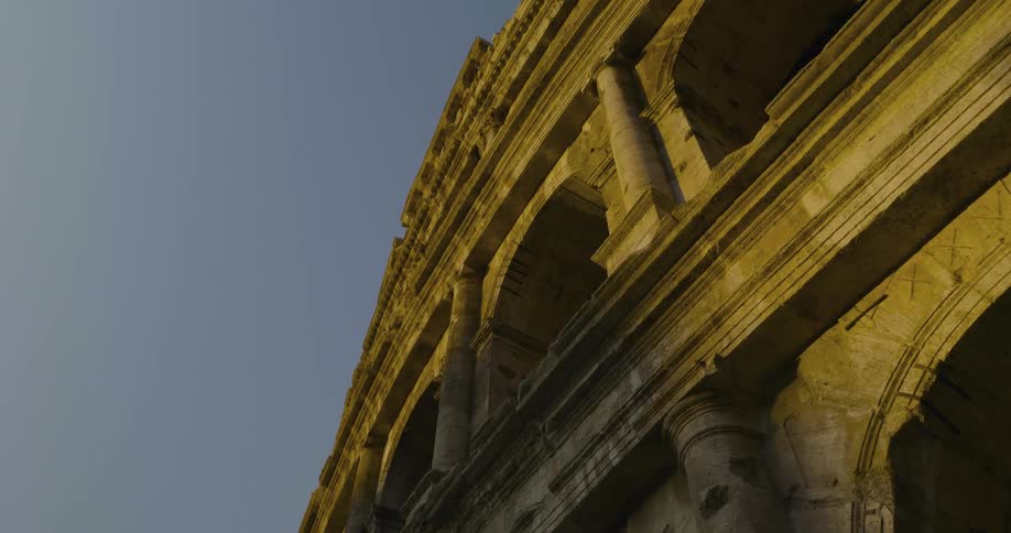 The outside of the coliseum at sunset