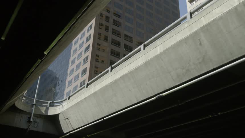 City buildings tower above a bridge