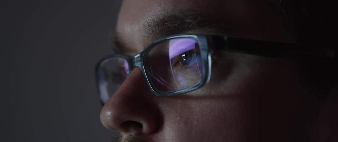 Close up of a man's face wearing glasses