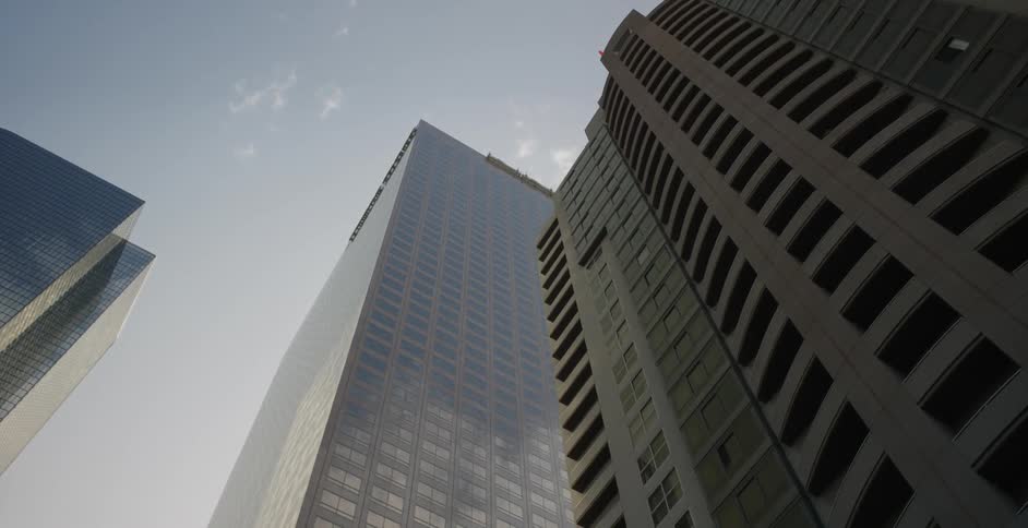 View looking up at skyscrapers on a sunny day