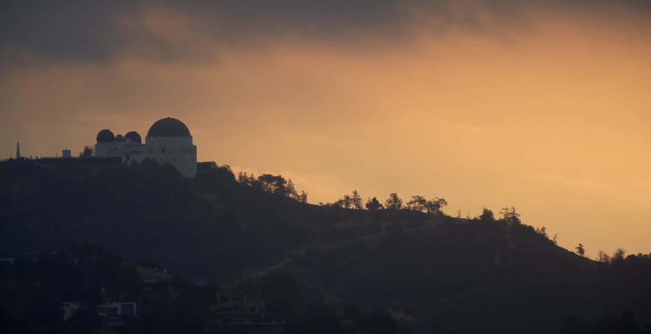 The hillside has a domed building at the top