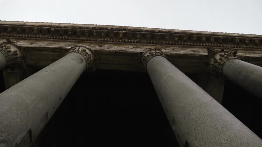 Stone pillars cover the side of a building