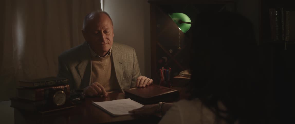 Man and woman sitting at a desk