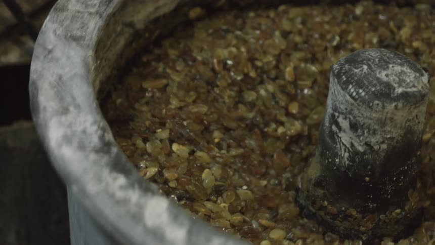 Yellow stones in a grinder