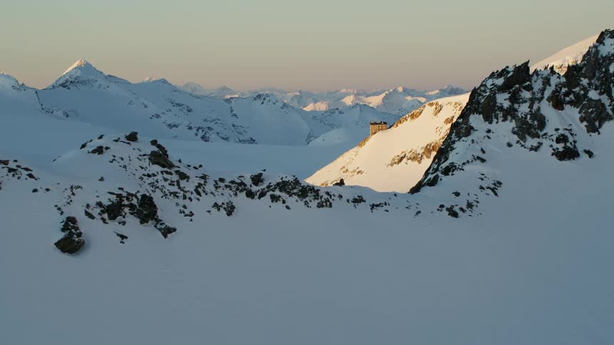 View of snowy mountains at sunset